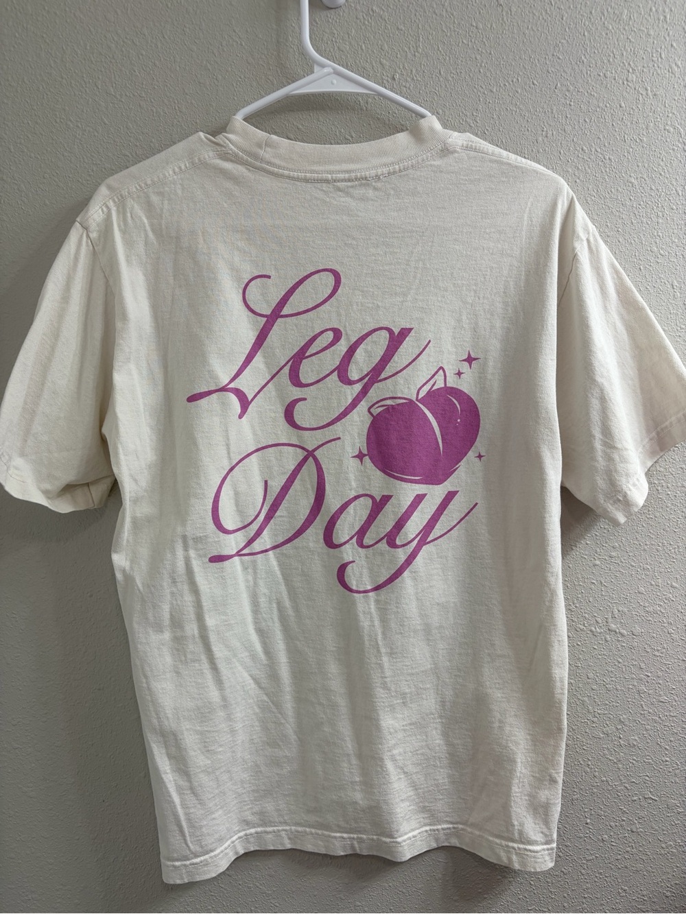 PARAGON Cream Short Sleeve Tee with Pink "Leg Day" Graphic